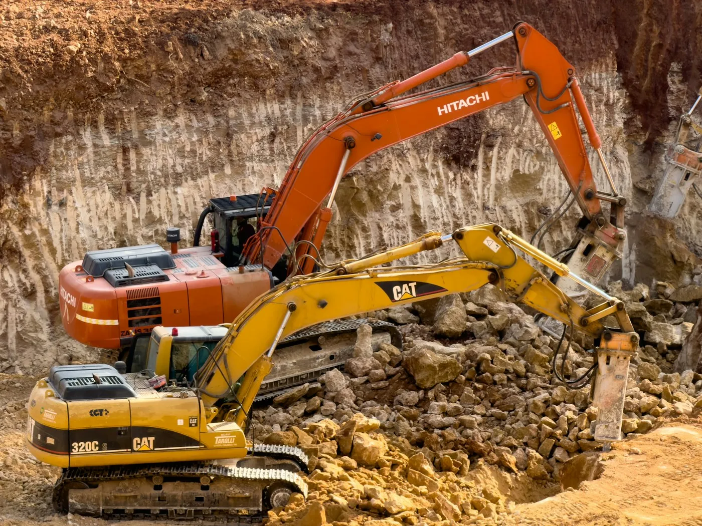 Excavators handling rock and soil